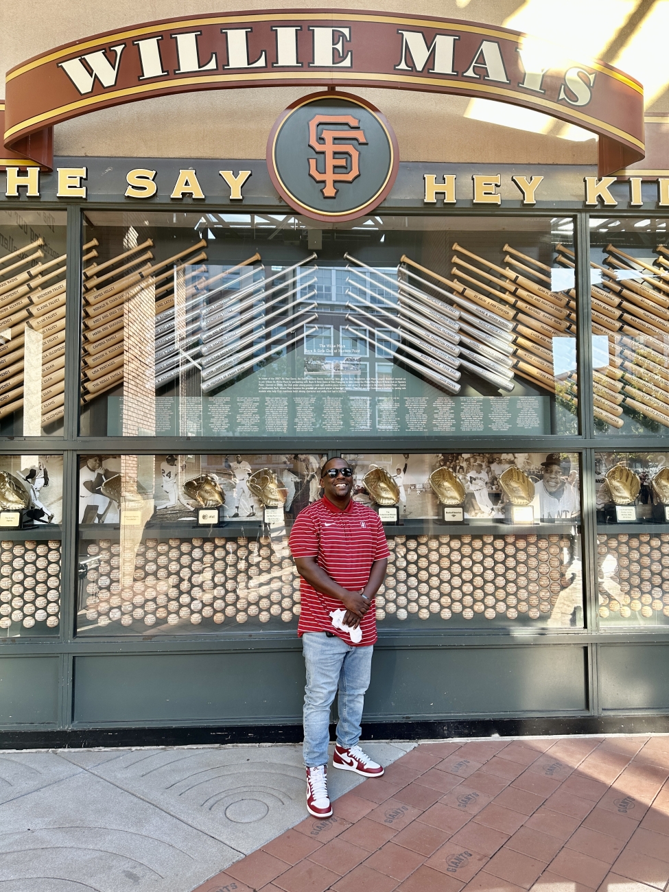 Albert Hughes standing in front of Willie Mays section in front of Oracle Park